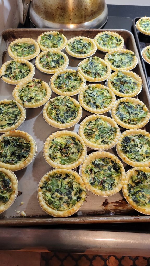 Many mall pies on a table